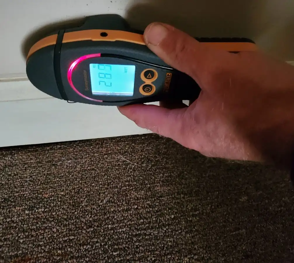 Moisture detection at baseboard during Storm Damage Restoration in Kahaluu